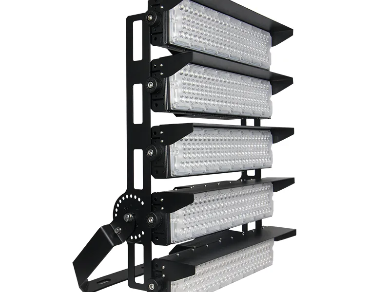 Black modular stadium floodlight with three adjustable LED heads on a mounting frame